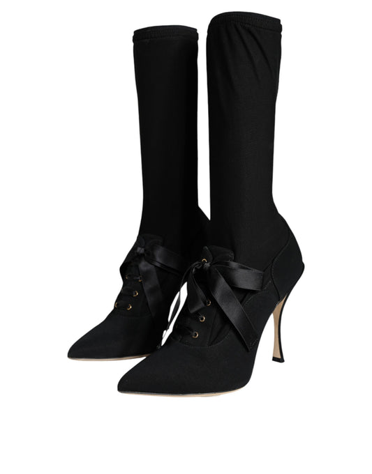 Pair of black knee high boots with heels