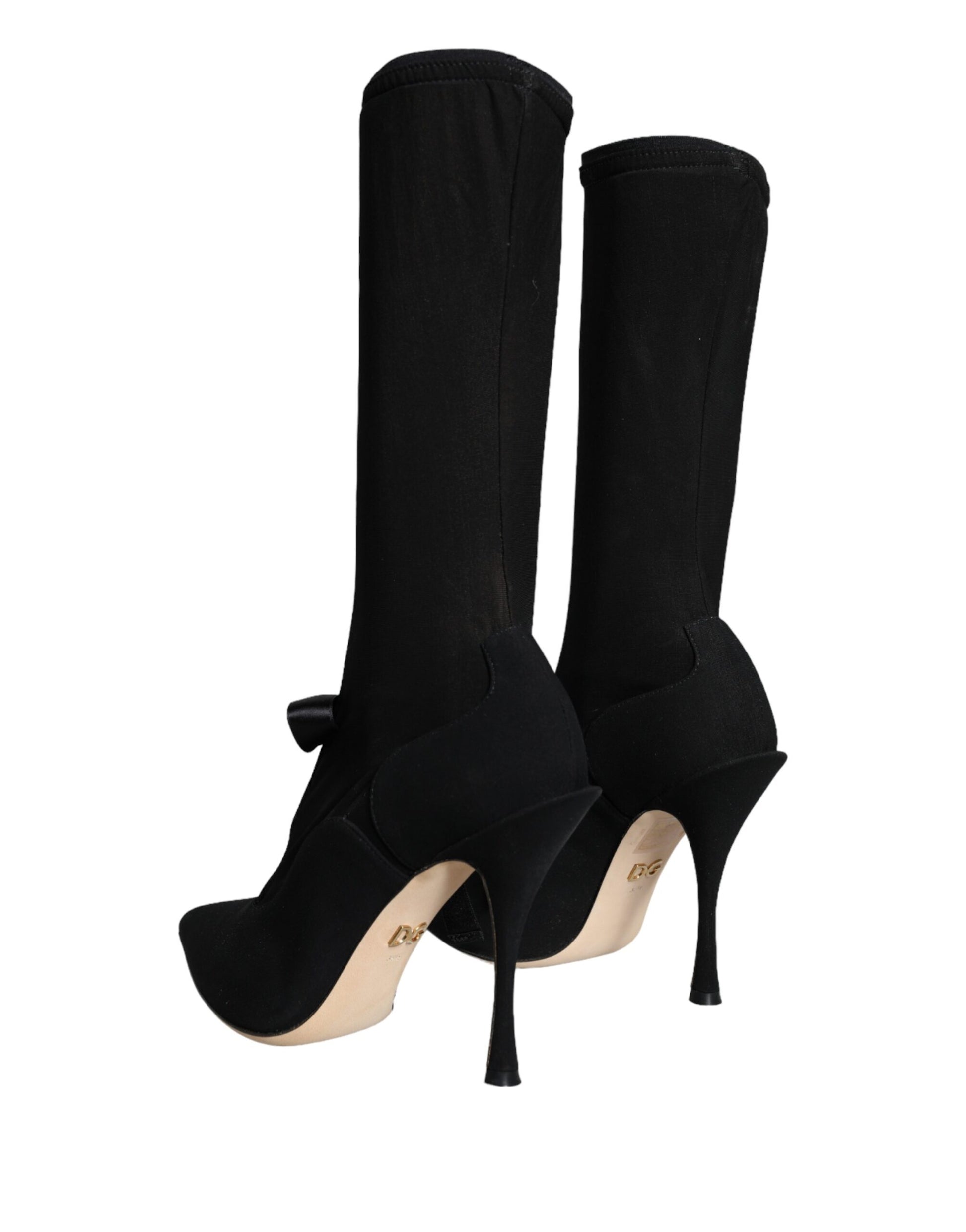 Pair of black knee high boots with heels