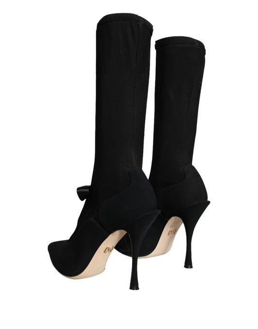 Pair of black knee high boots with heels
