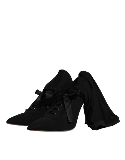 Pair of black suede shoes with laces and bow detailing