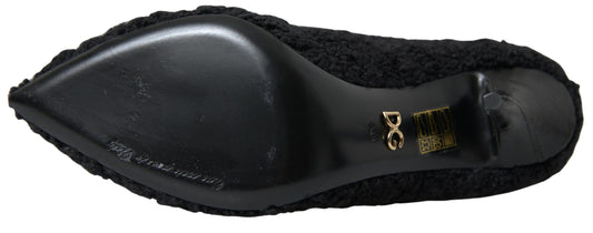 Black high heel shoe with gold buckle and strap