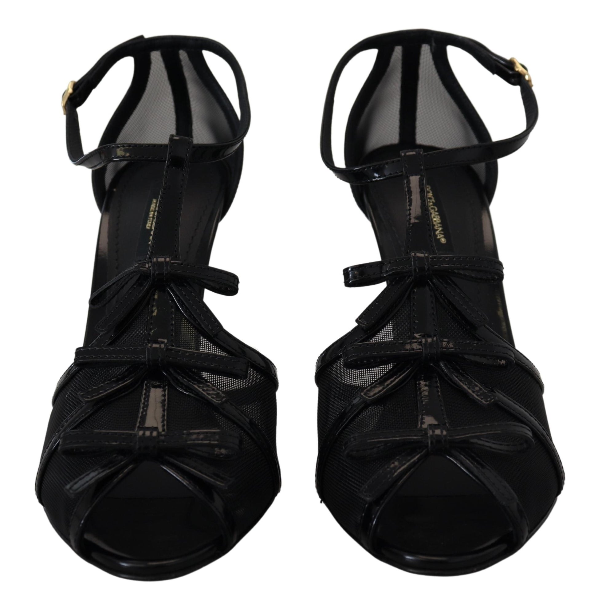 Pair of black high heel shoes with straps and buckles