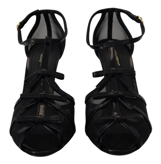 Pair of black high heel shoes with straps and buckles