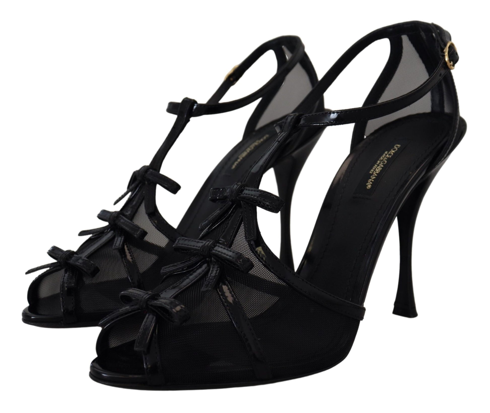 Pair of black high heel shoes with straps and bow detailing