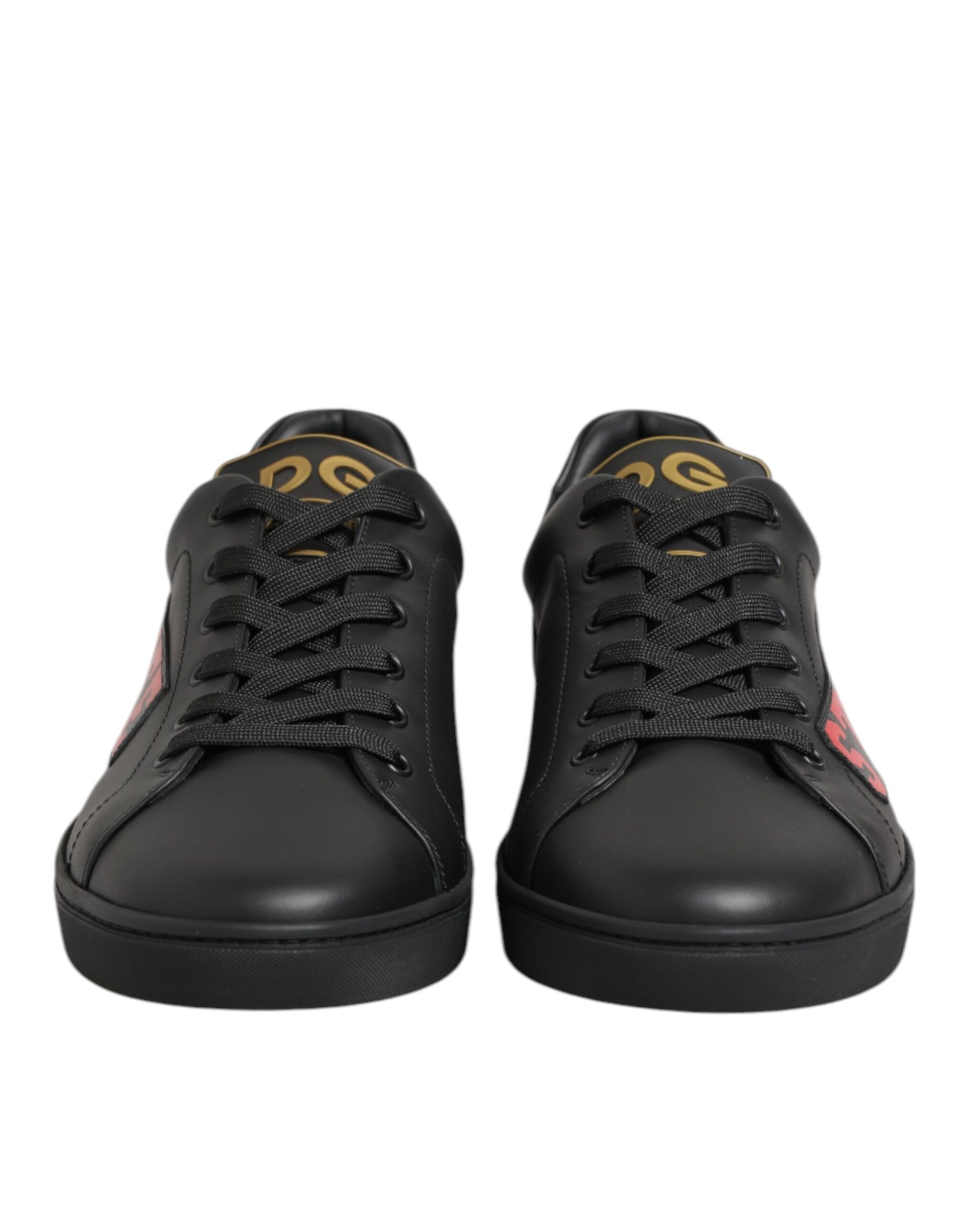 Pair of black sneakers with gold accents