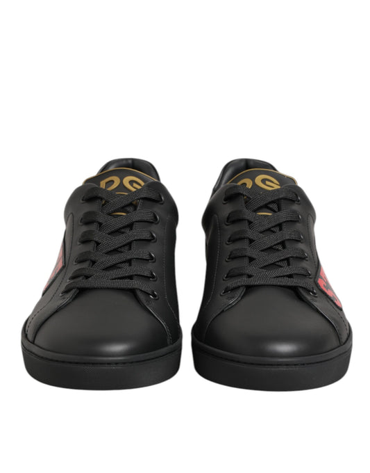 Pair of black sneakers with gold accents