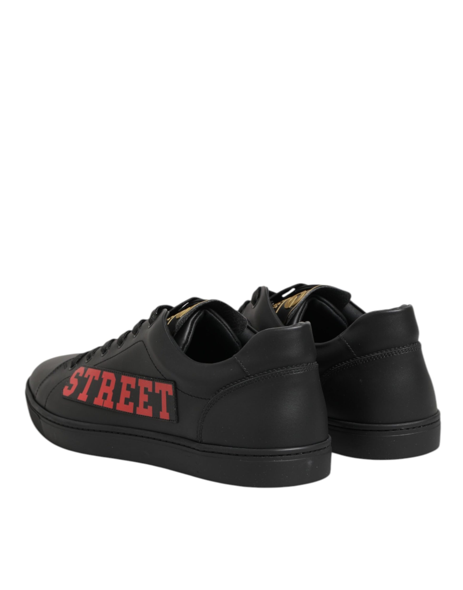 Black sneakers with red lettering on side