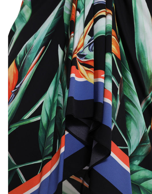Colorful tropical print dress with red, blue, yellow, and green leaves on a black background
