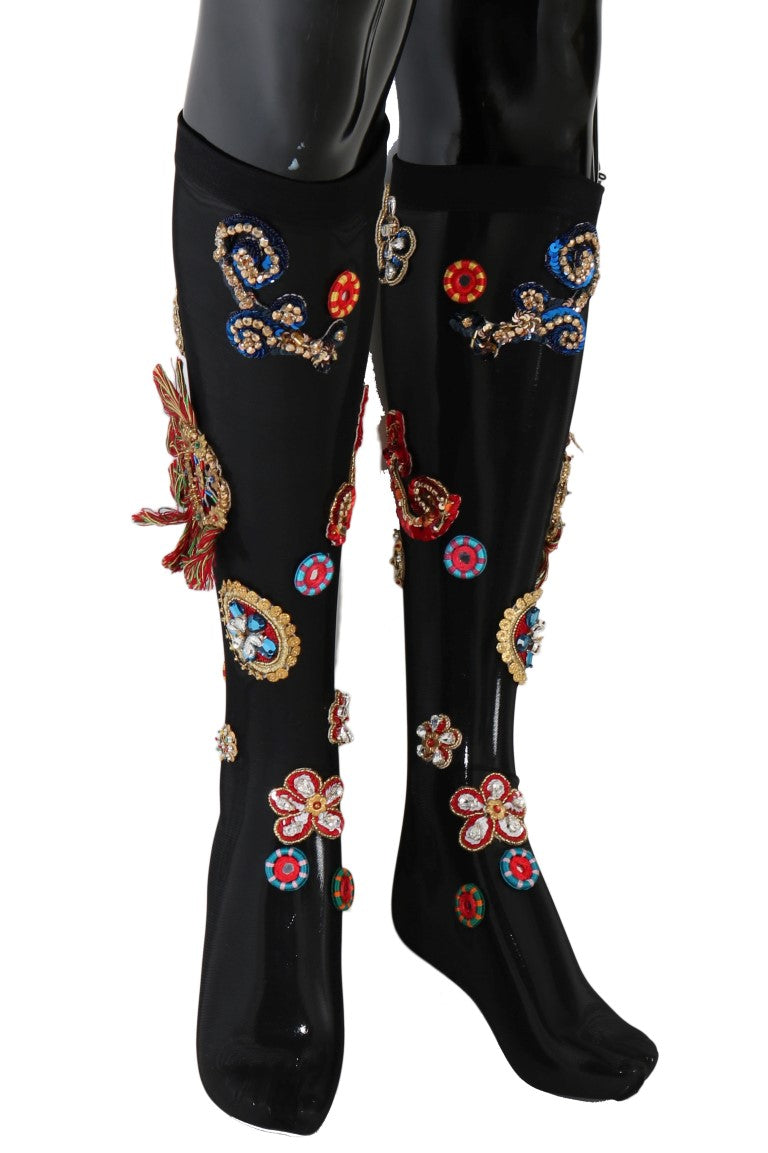 Black knee high boots with floral embroidery on sides