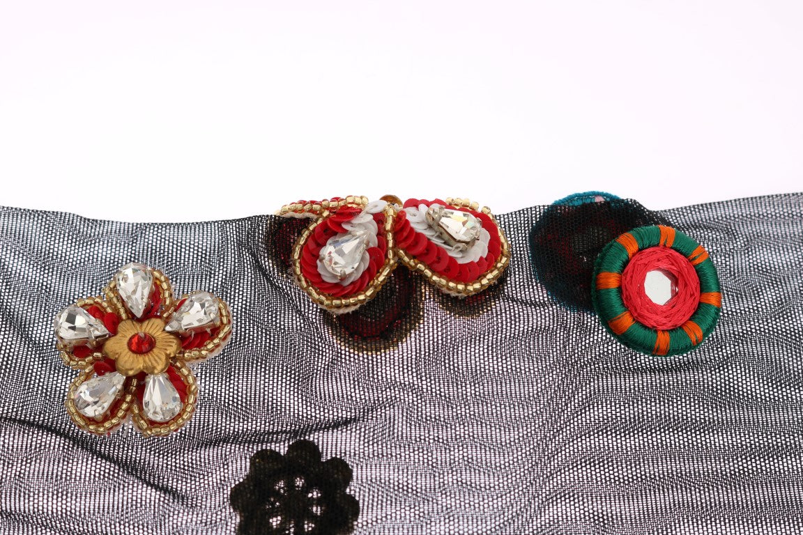 Decorative earrings on a fabric background