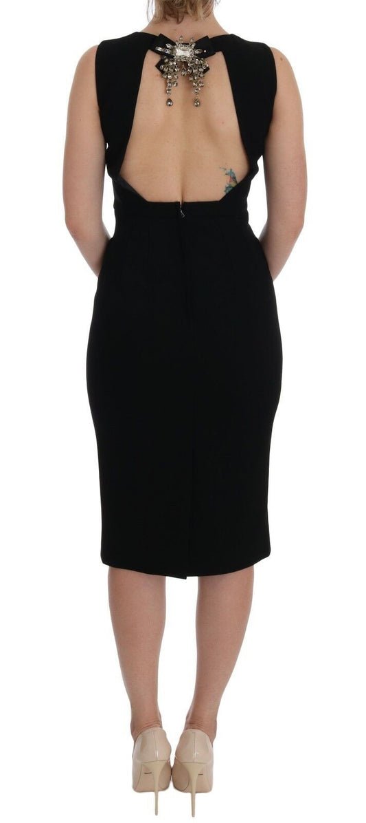 A black strapless sheath dress with crystal embellishments on the back