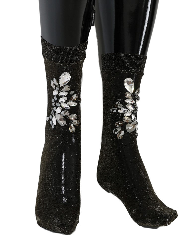 Black boots with glittery embellishments on legs