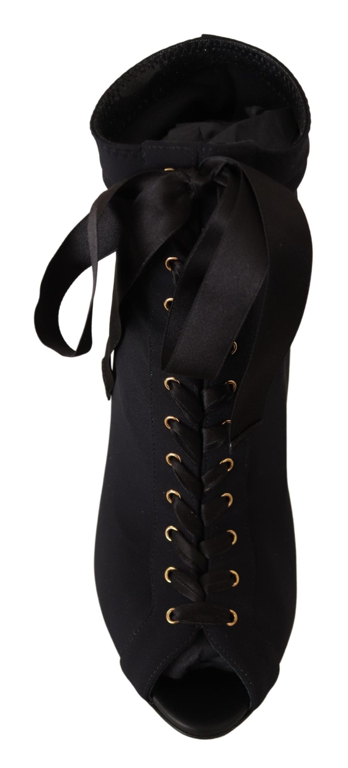 Black boot with gold buttons and a bow on top