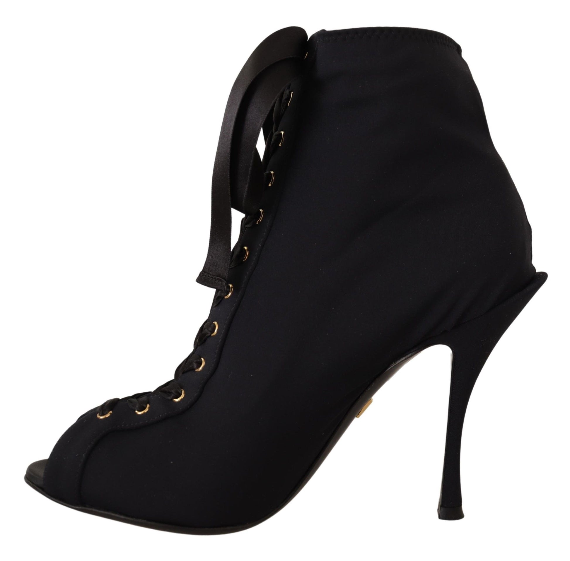 Black ankle boot with gold buckles and a stiletto heel