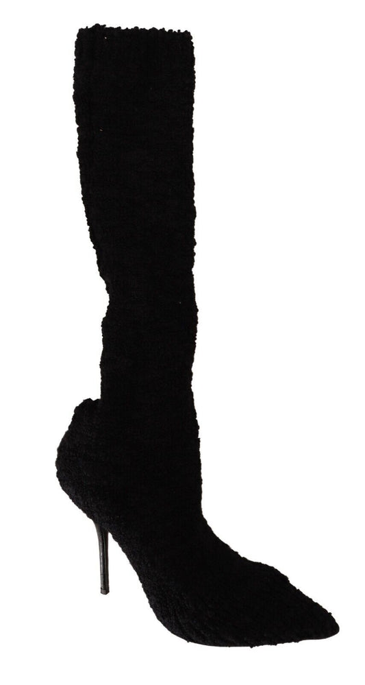 Black high heel boot with a pointed toe and stiletto heel