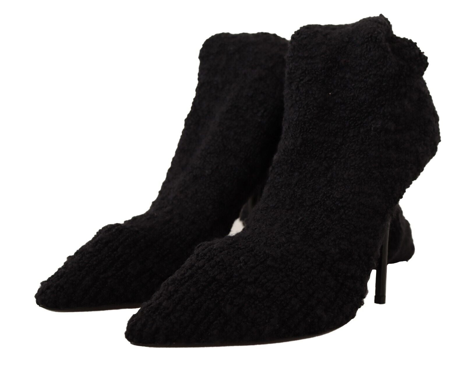 Pair of black suede boots with fur trim and heels