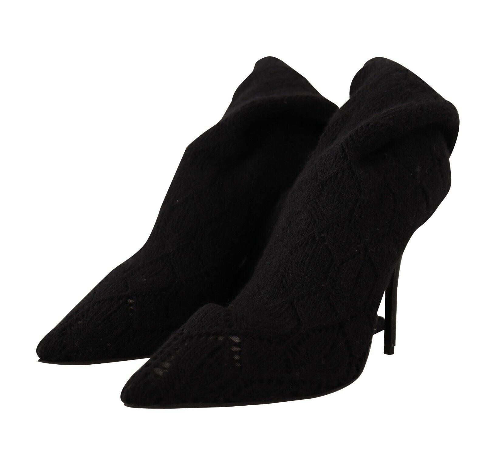Pair of black knee high boots with fur trim and heels