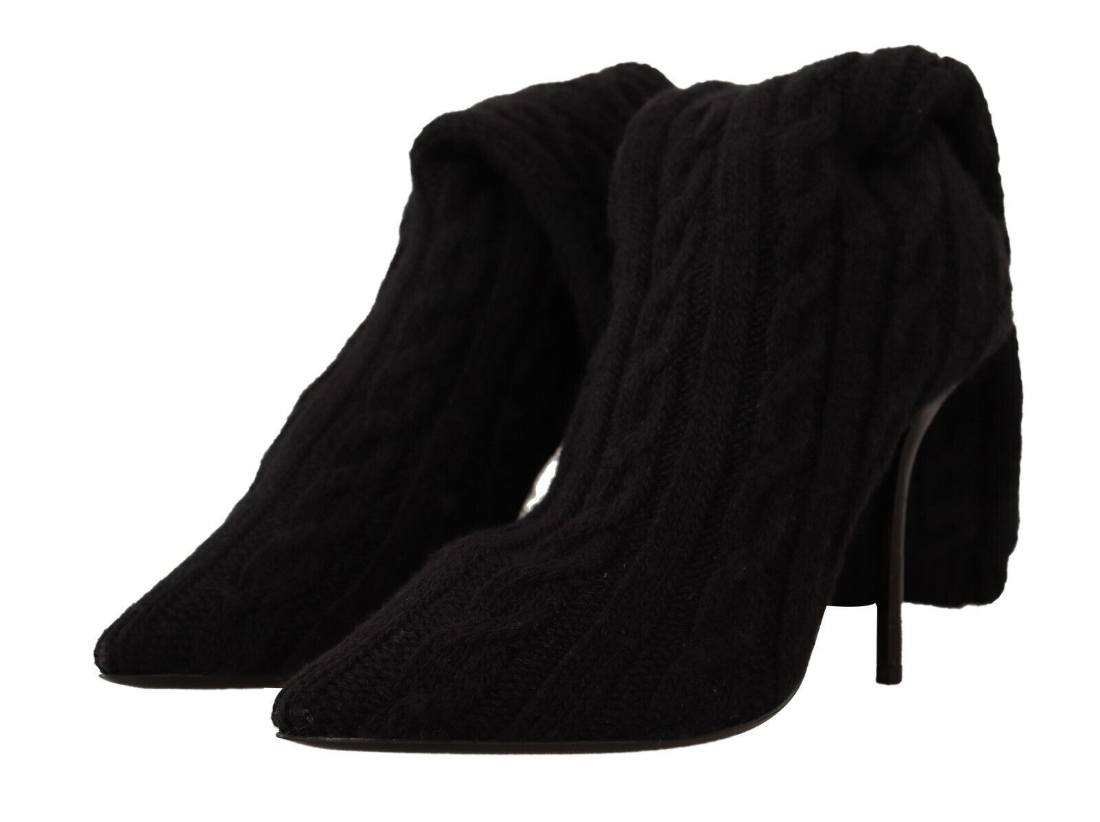 Pair of black boots with fur trim and a heel