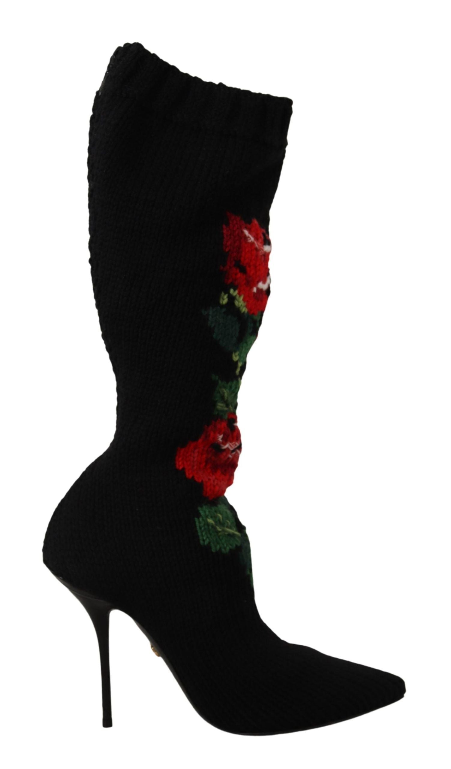 Black high heel boot with floral pattern on side and flower embellishment at top