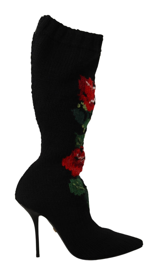 Black high heel boot with floral pattern on side and flower embellishment at top