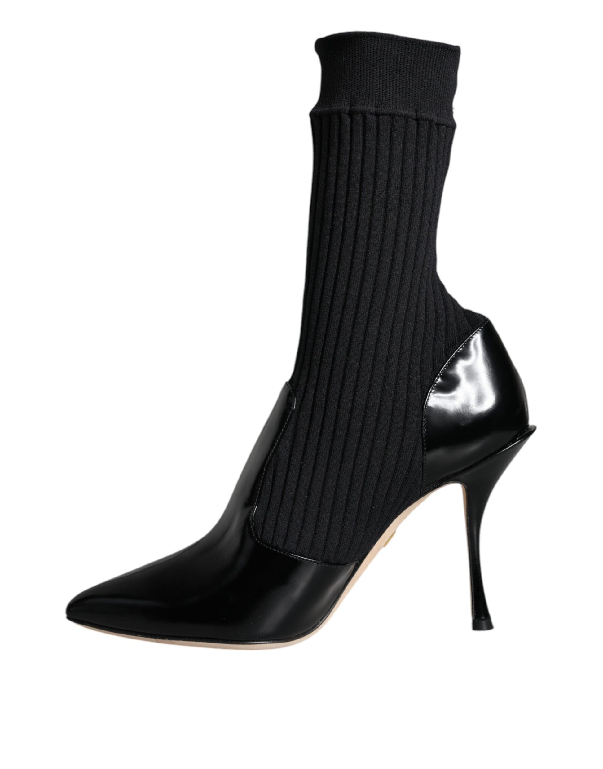 Black boot with black sock and heel