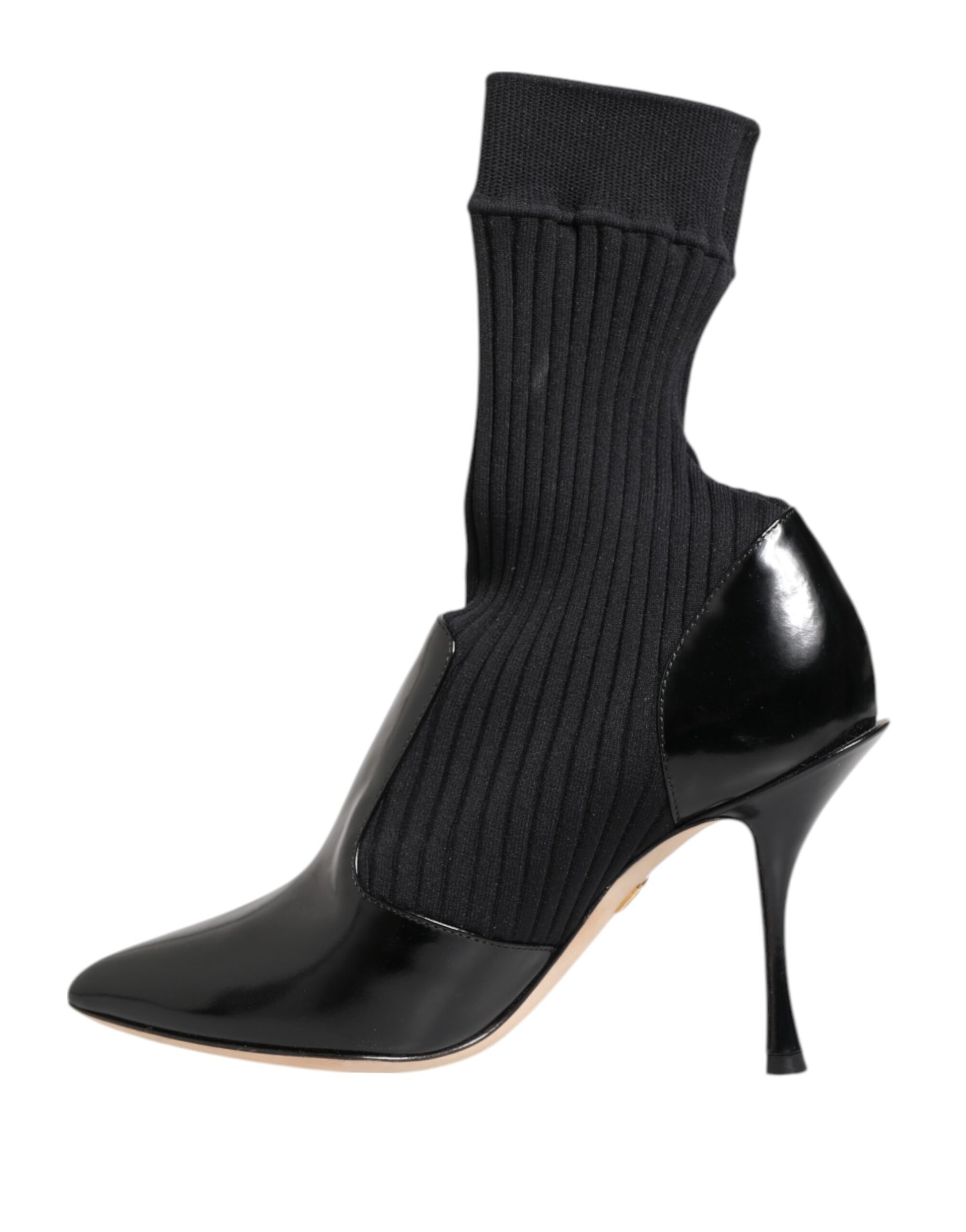 Black boot with black sock and heel