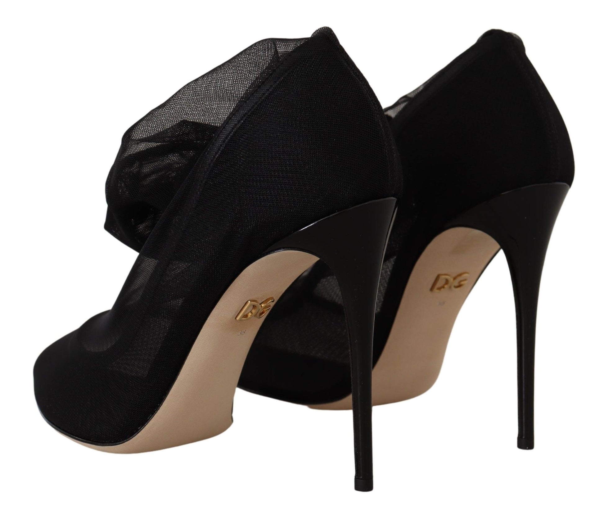 Pair of black high heel shoes with gold trim and a bow on top