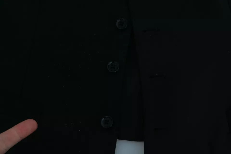A black wool vest with buttons and a stretch waist