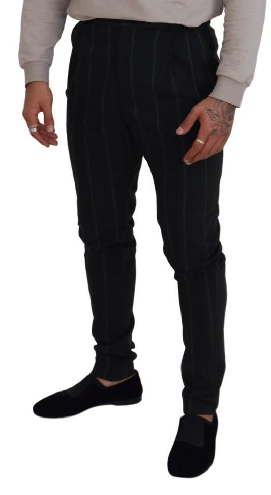 Man wearing black pants with white stripes down side