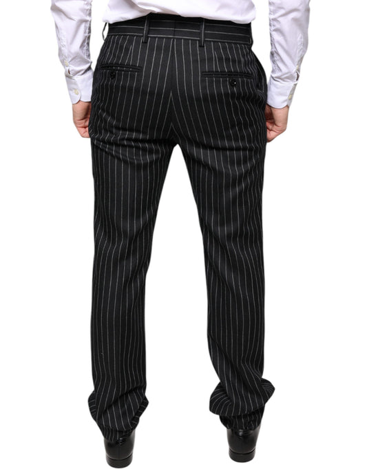 A pair of black pants with thin vertical stripes, designed by Dolce & Gabbana. They are intended for men and