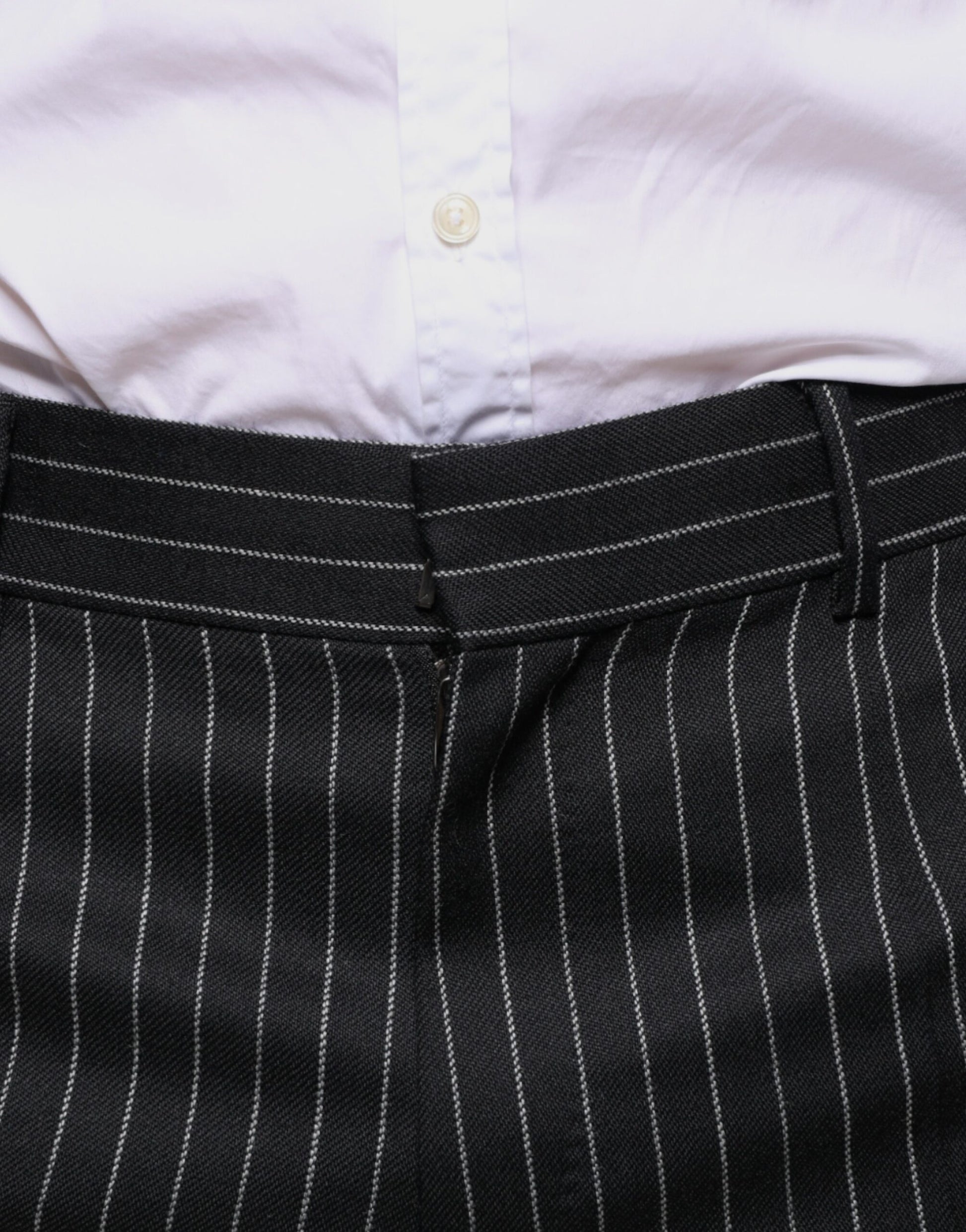 A pair of black striped men's dress pants from the brand Dolce & Gabbana