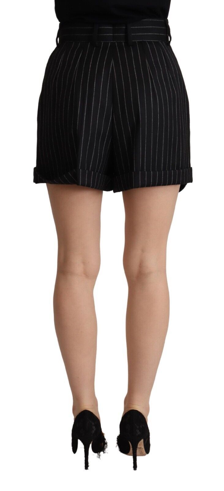 Black pencil skirt with white stripes, worn by a person standing against a grey background