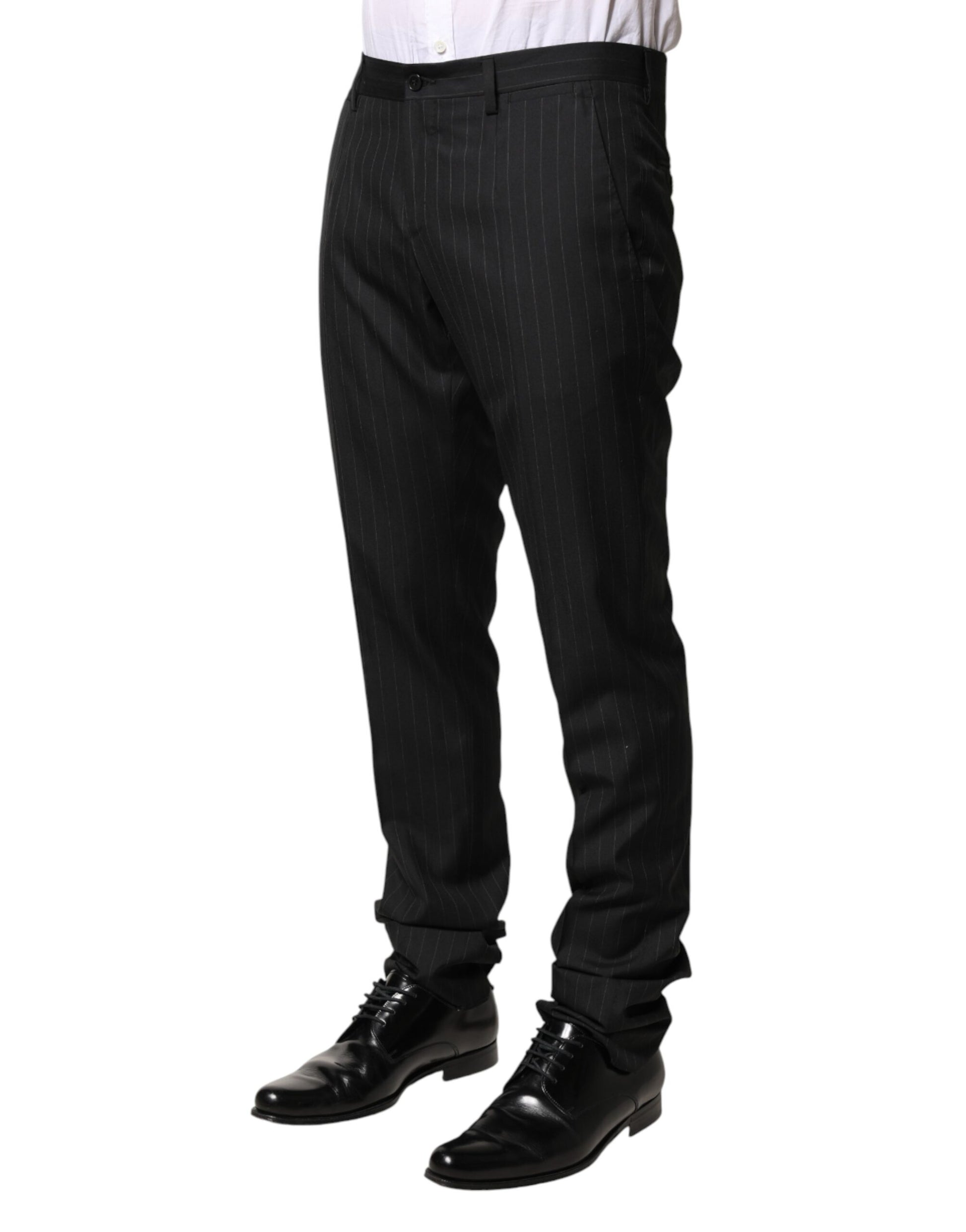 A pair of black wool trousers with stripe detailing, designed for men. They are part of the Dolce & Gabbana b