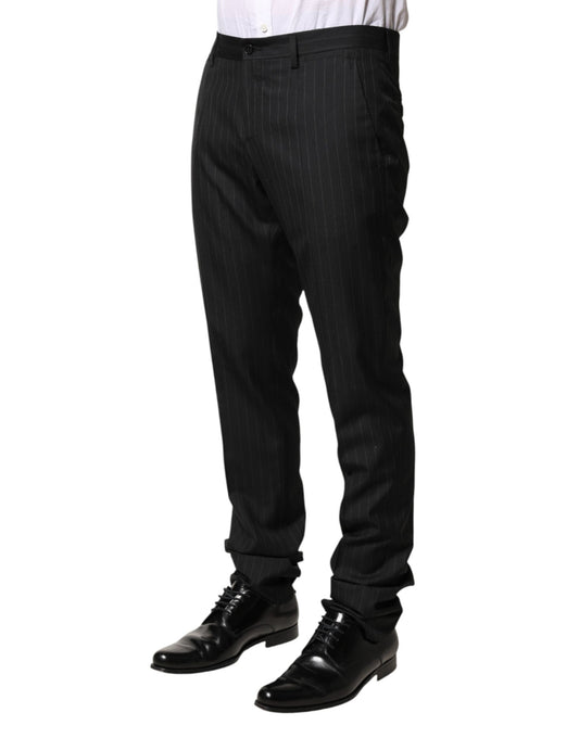 A pair of black wool trousers with stripe detailing, designed for men. They are part of the Dolce & Gabbana b