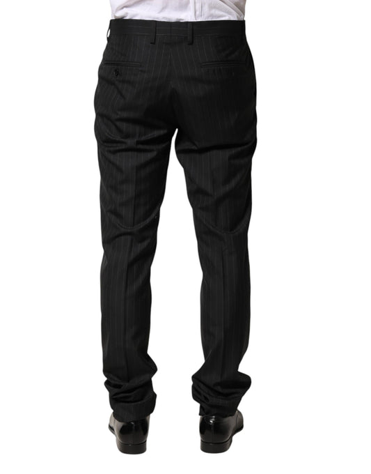 A pair of black wool trousers with stripe pattern, designed for men. They are part of the Dolce & Gabbana bra