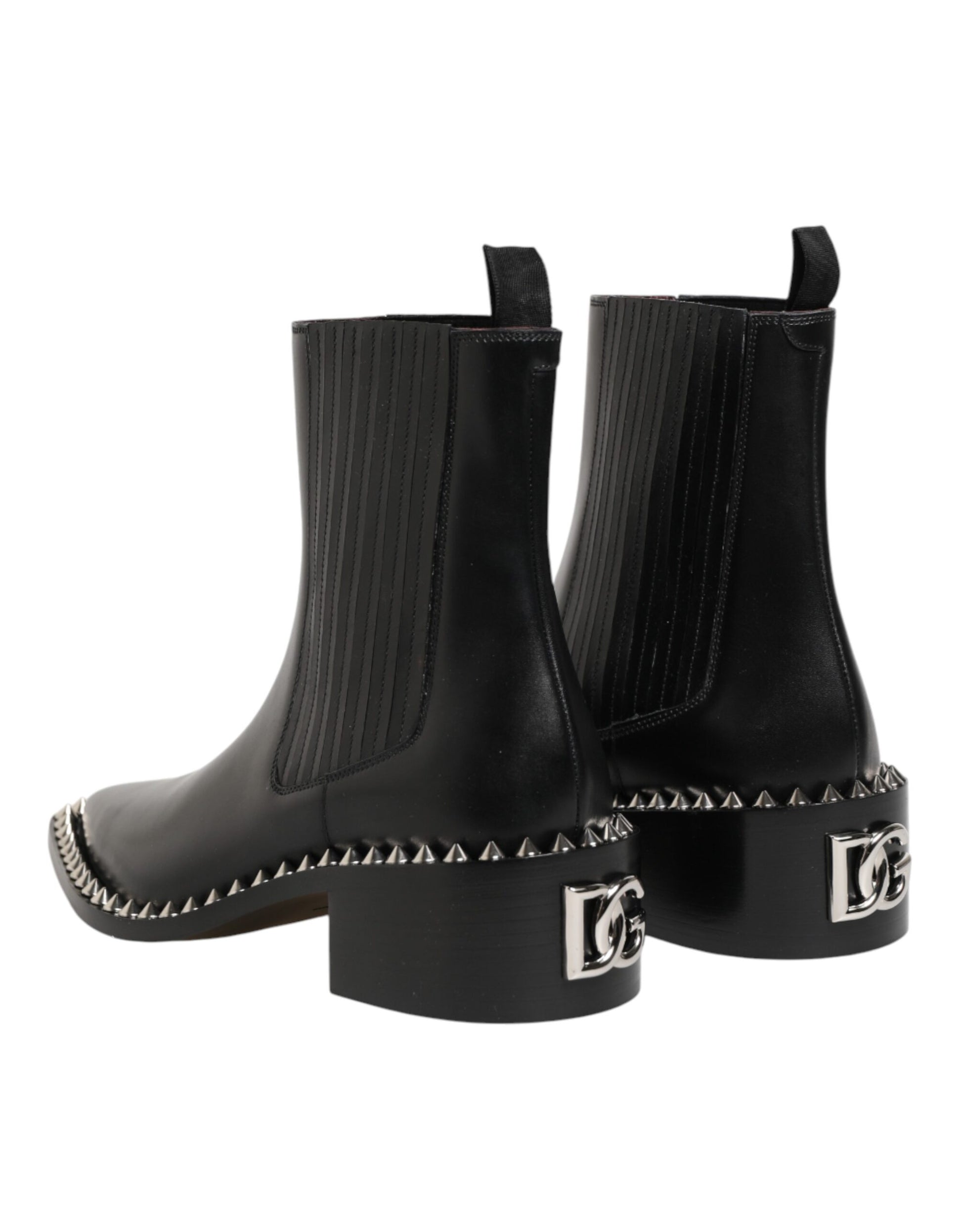 Pair of black boots with studded details on soles