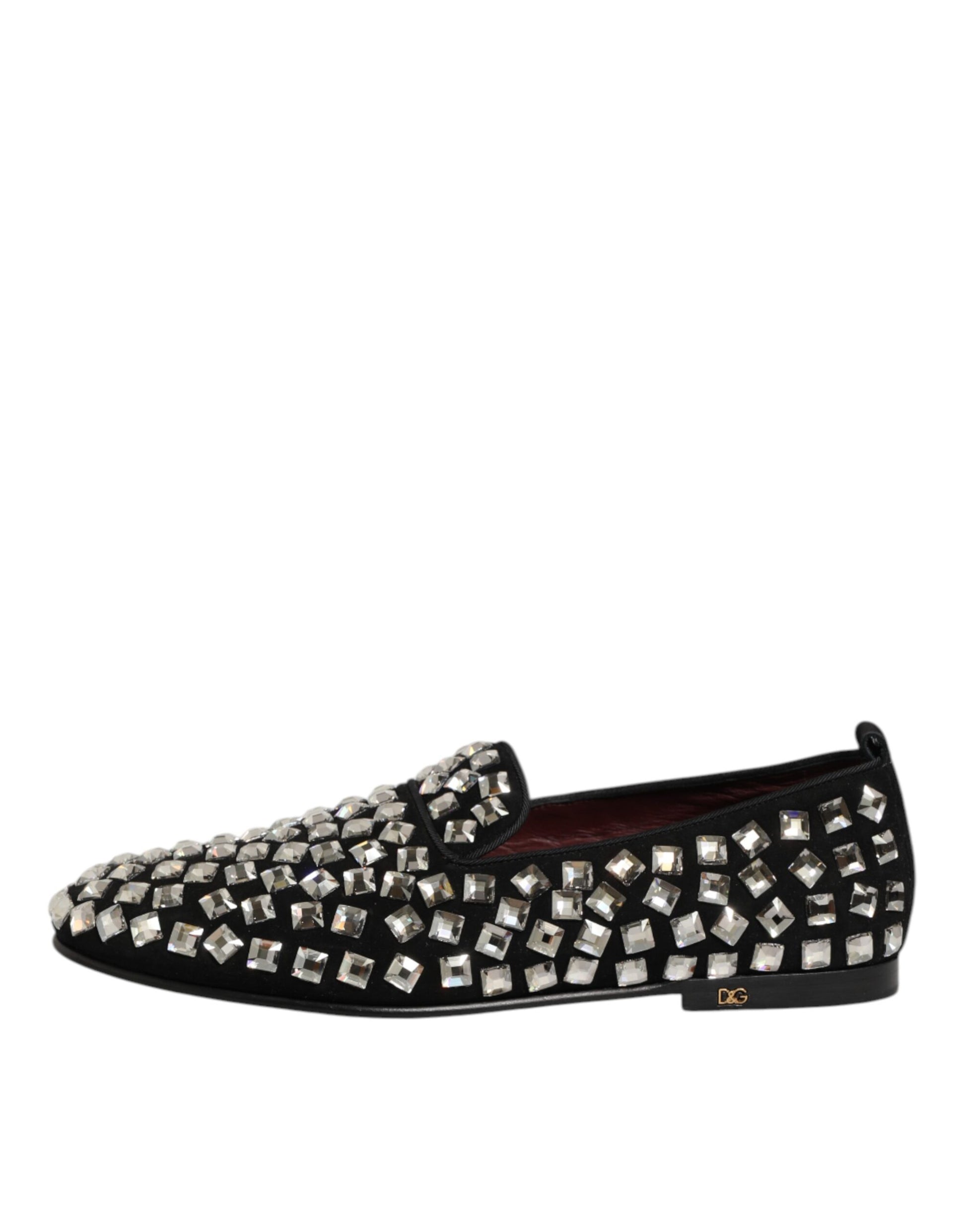 A pair of black suede loafers with crystal embellishments, designed by Dolce & Gabbana for men