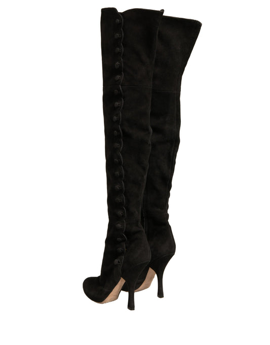 Black knee high boots with stiletto heels