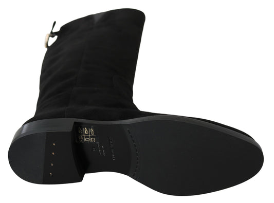 Pair of black leather boots with zipper closure and visible stitching details