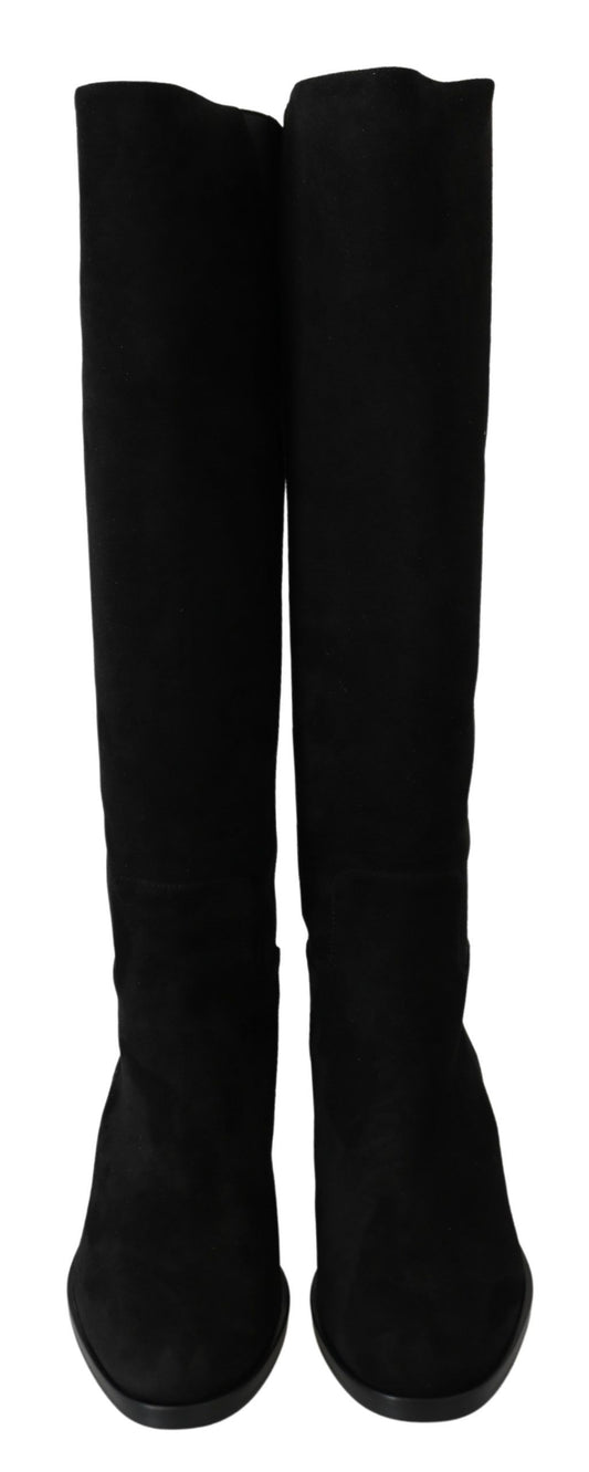 Pair of black knee high boots with heels