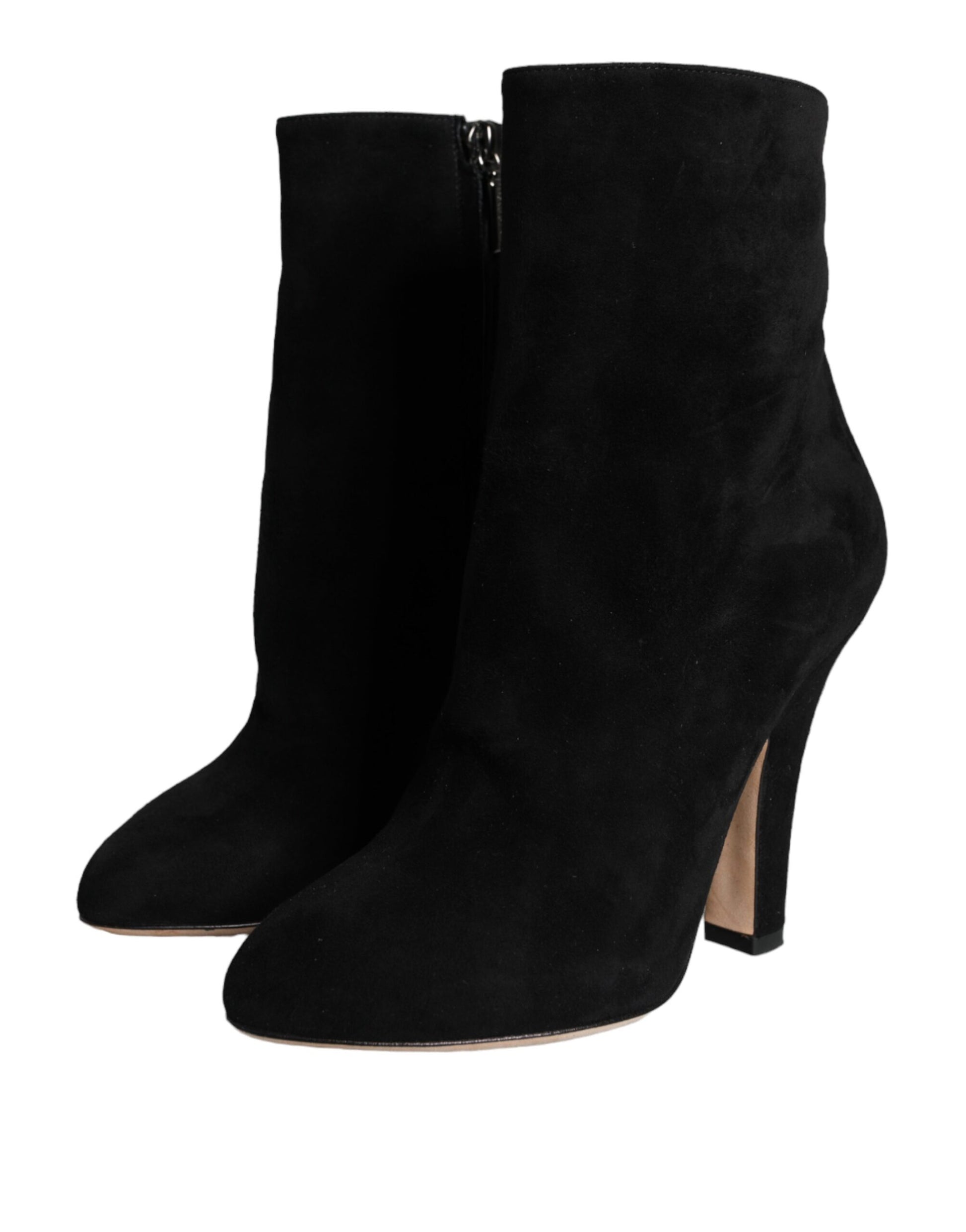 Pair of black suede boots with heels