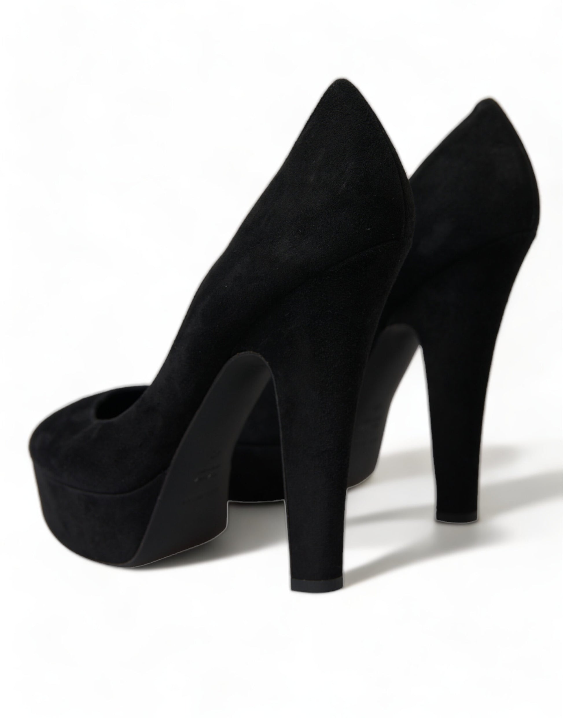 Pair of black high heel shoes with pointed toe and stiletto heels