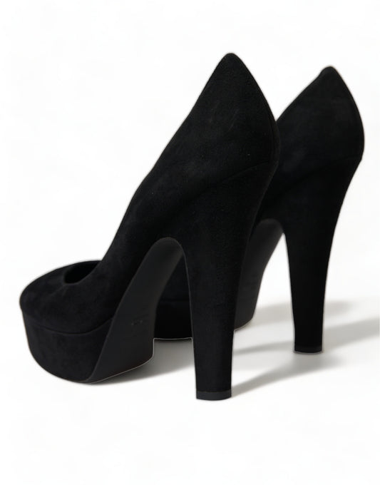 Pair of black high heel shoes with pointed toe and stiletto heels