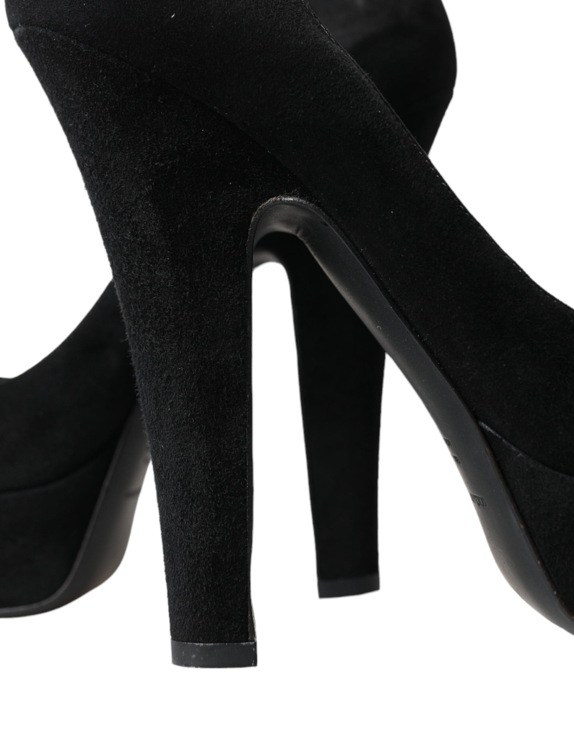 Pair of black suede high heel shoes with pointed toe and stiletto heel