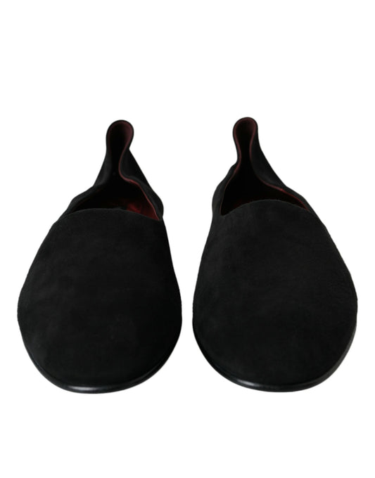 Pair of black velvet slippers with red soles