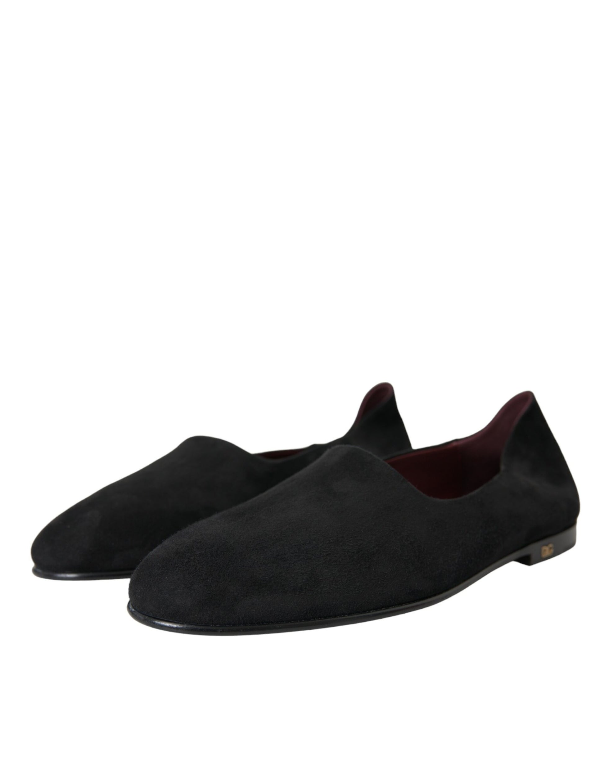 Pair of black velvet loafers with red trim and gold accents