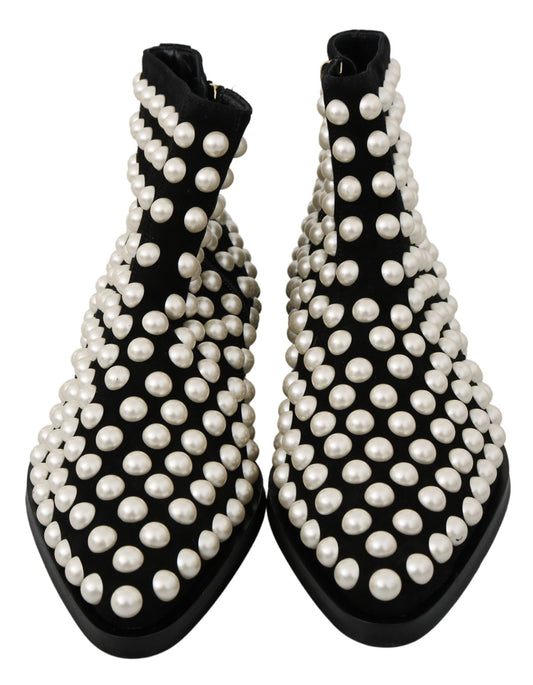 Pair of black boots with pearl embellishments