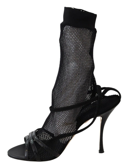Black high heel shoe with mesh stocking and black straps
