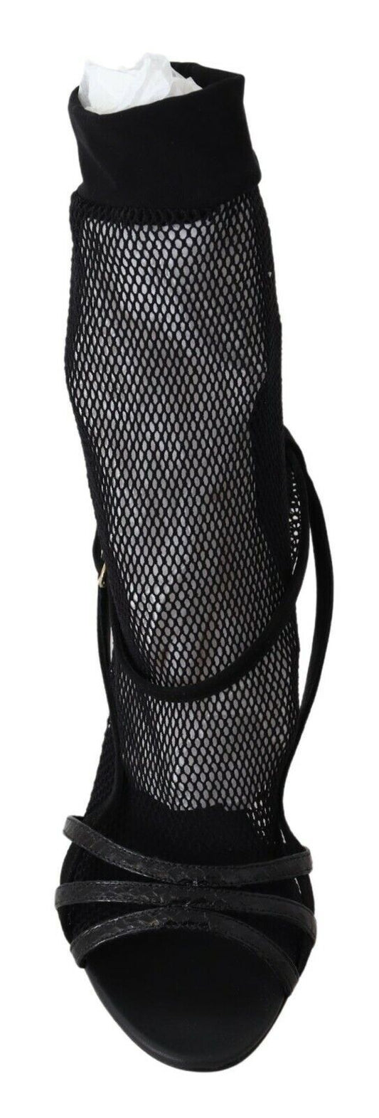 Black high heel shoes with fishnet stockings and black laces