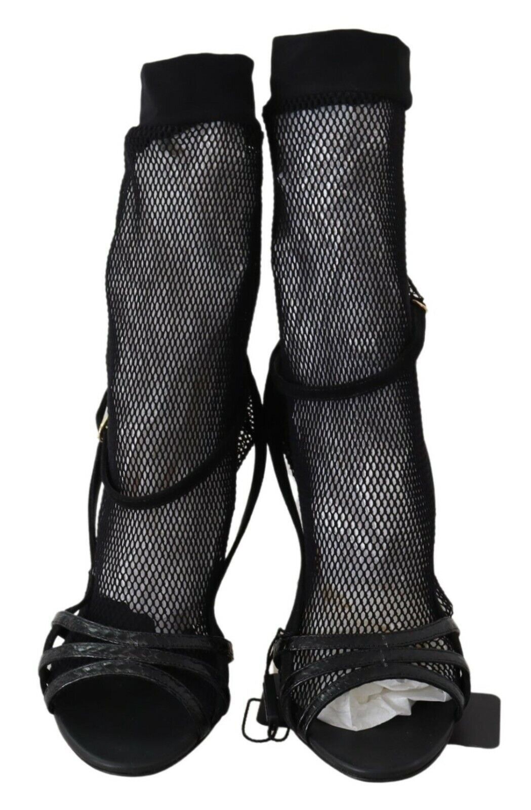 Pair of black high heel shoes with fishnet texture and straps